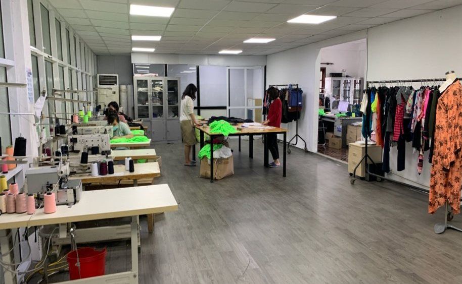 TAV R&D center and sample room with sewing tables and sample racks