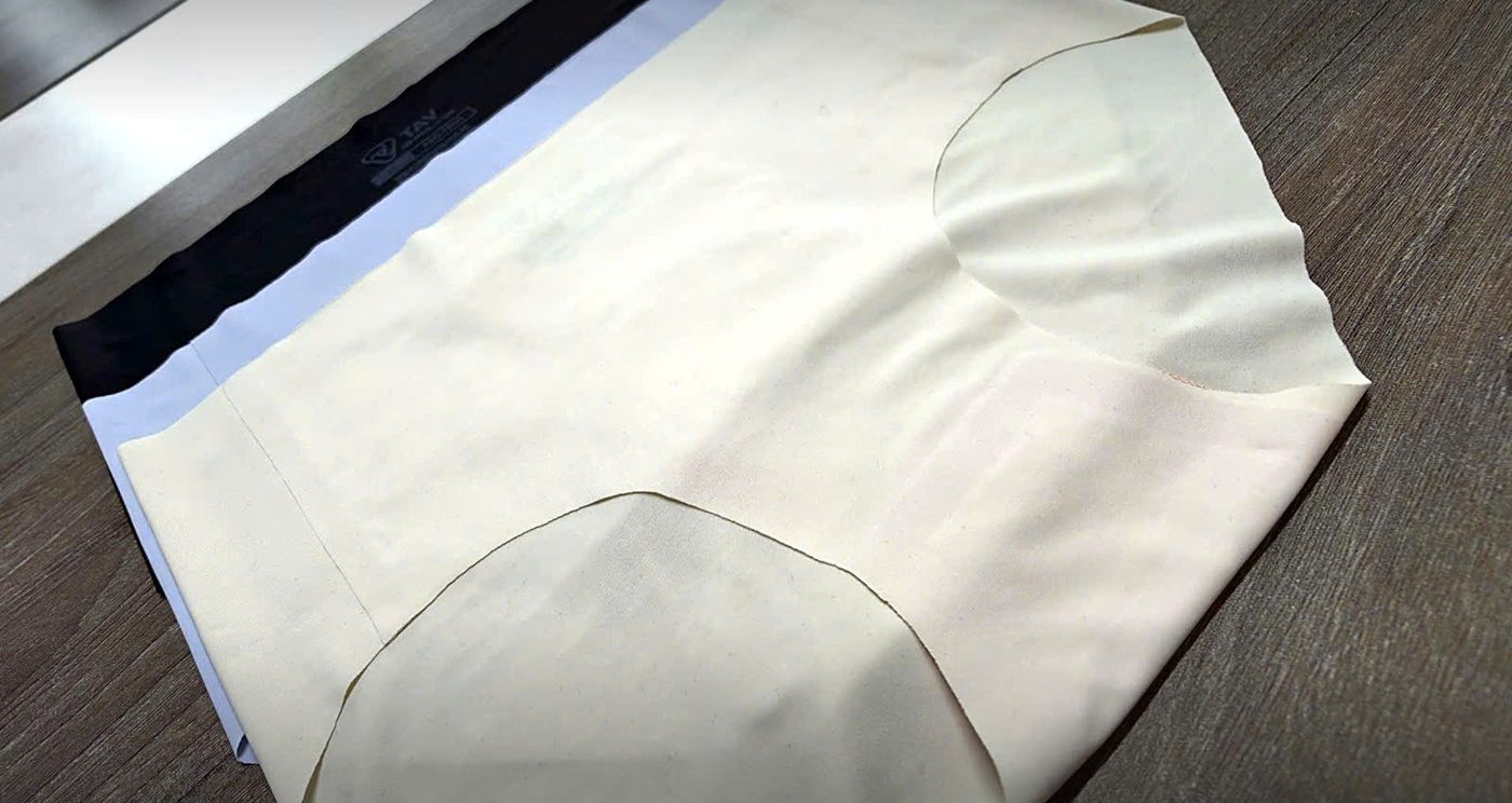 Stack of TAV women's seamless bonded briefs in nude, white and black with bonded logo waistband